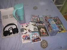 Miscellenious items music player headphone ties dvds swim masks