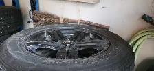 Aftermarket black 'DAI' rims with studded tires - Photo 3