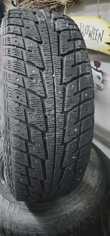 Aftermarket black 'DAI' rims with studded tires - Photo 4