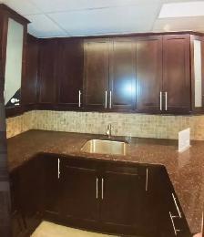 Taj Mahal Granite Countertop With Wooden Island - Photo 2