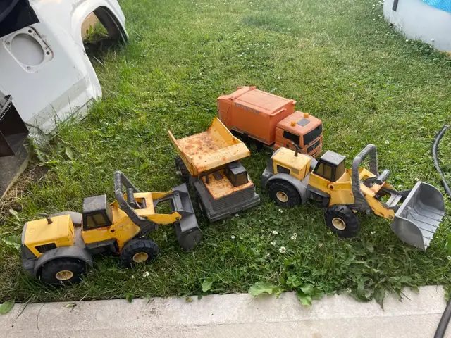 Two Tonka front loaders and dump truck, and Garbage truck