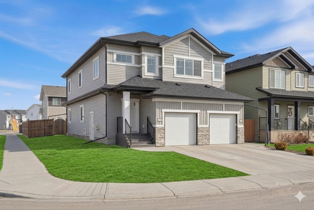 UP/DOWN LEGALLY SUITED HOME IN BLACKFALDS