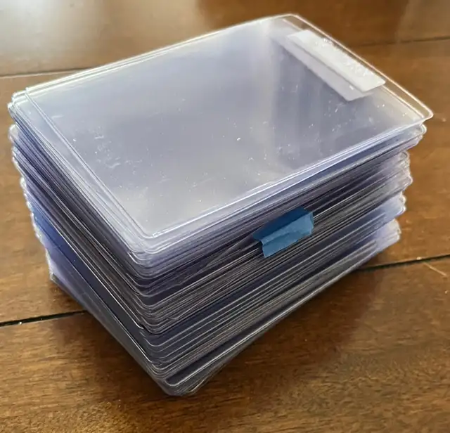 100 used plastic Semi-Rigid card holders. Like New!
