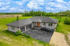 Sturgeon County out of a subdivision! 2 garages, custom built.