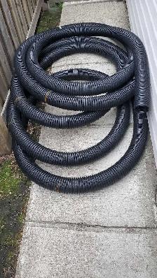 70 feet of Armtec 4 inch non-perforated HDPE plastic hose.