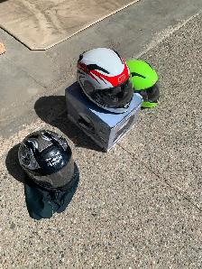 3 helmets,  1 adult,   2 kids