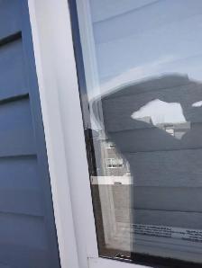 Vinyl Window Frame and glass repair after the hail damage - Photo 2