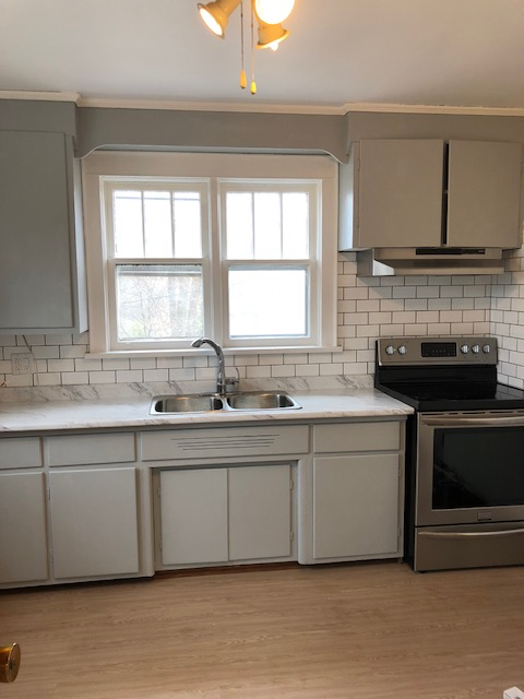 1 bedroom on main level, large backyard, parking and laundry