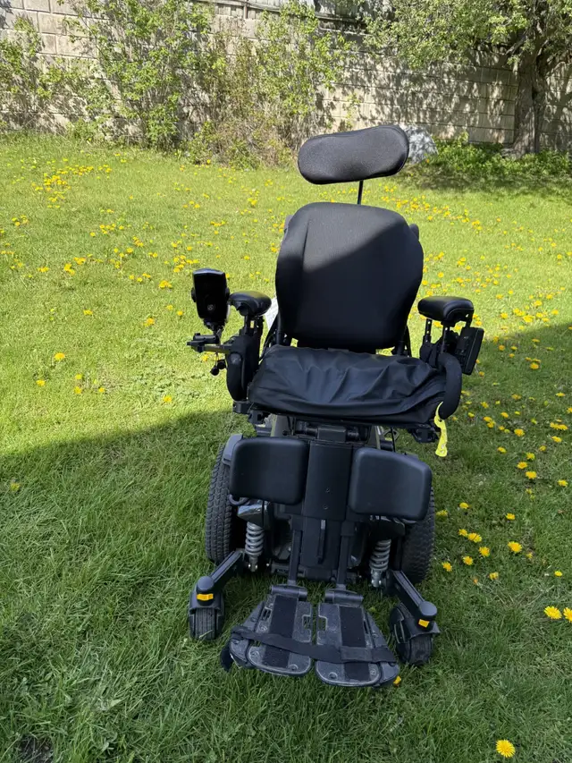 Quantum  power wheelchair with tilting and eleveted footrest too