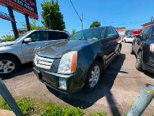 Cadillac SRX 2008 aut. Cruir. toit.AWD $4495. rusty 450-820-0550