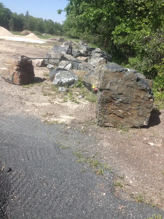 BLACK GRANITE BOULDERS WE DELIVER AND INSTALL