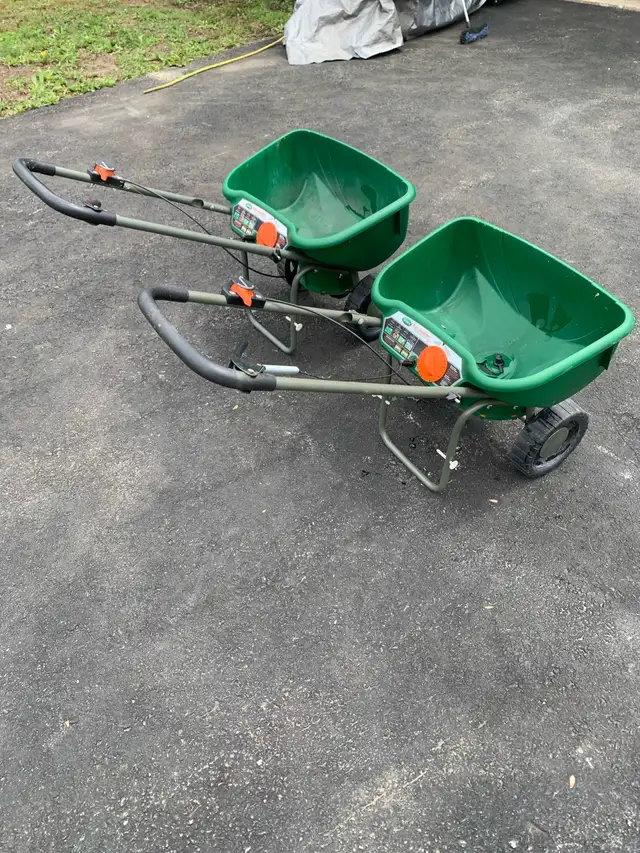 two deluxe Scott fertilizer spreaders/ 90.00 each