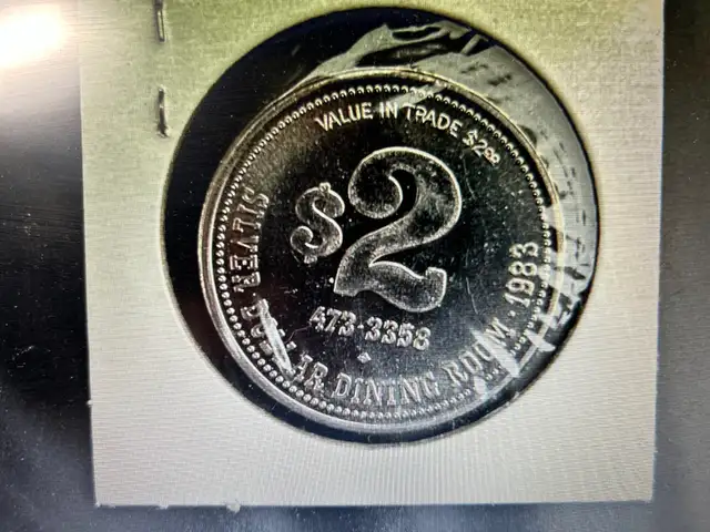 ONE COLLECTABLE 1983 SILVER DOLLAR DINNING ROOM TOKEN IN EDMONTO