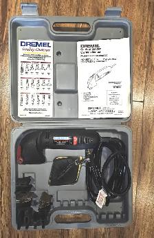 LIKE NEW DREMEL CONTOUR SANDER KIT WITH ATTACHMENTS. HAS MANUAL.