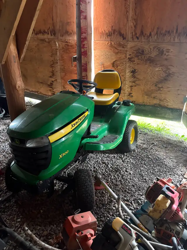 John Deere X300 lawn tractor with deck