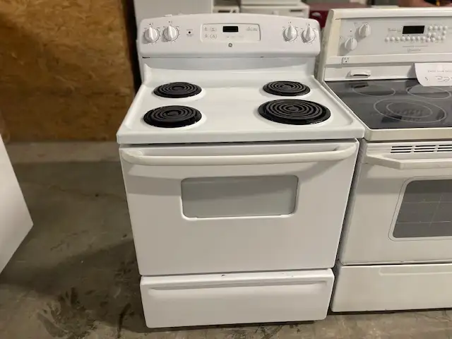 Cuisinière blanche ronds serpentins GE