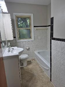 Available August 1st, three-bedroom main floor with laundry - Photo 9