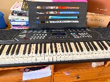 Electronic keyboard player with stand and bench. Full 88 keys.