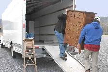 Moving truck with movers - Photo 2