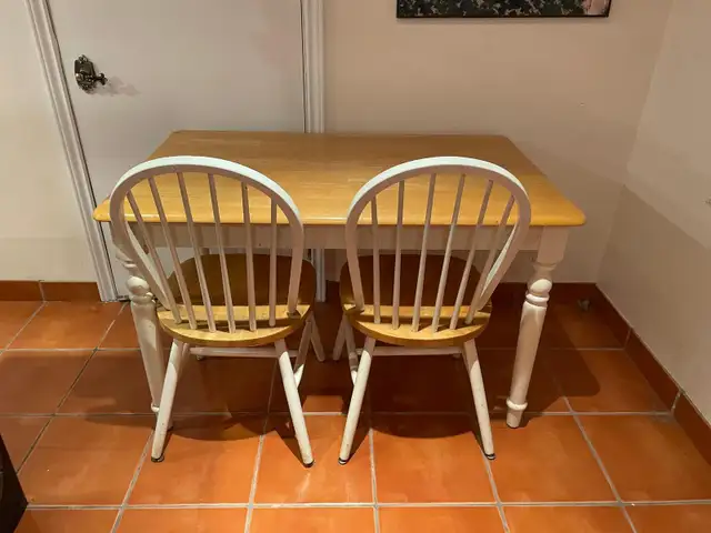Table with four chairs in excellent condition.
