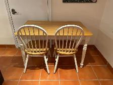 Table with four chairs in excellent condition.