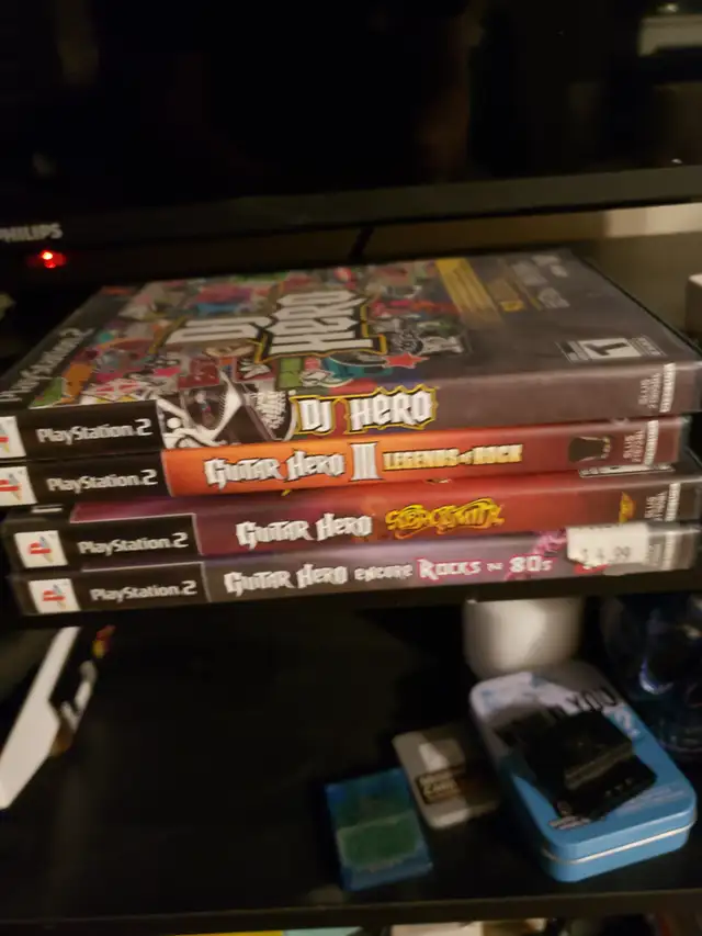 4 playstation 2 guitar hero games with 2 guitars