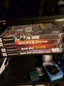 4 playstation 2 guitar hero games with 2 guitars