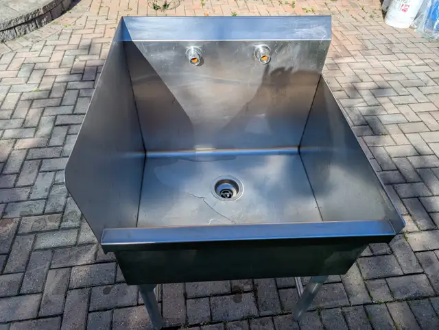 Commercial stainless steel utility sink with backsplash