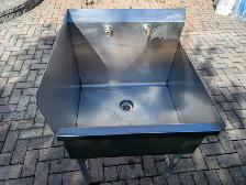 Commercial stainless steel utility sink with backsplash