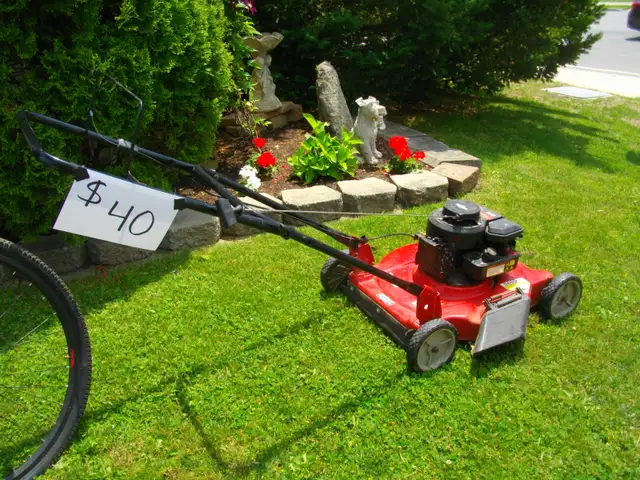 RED LAWN MOWER FOUND IN STORAGE UNIT