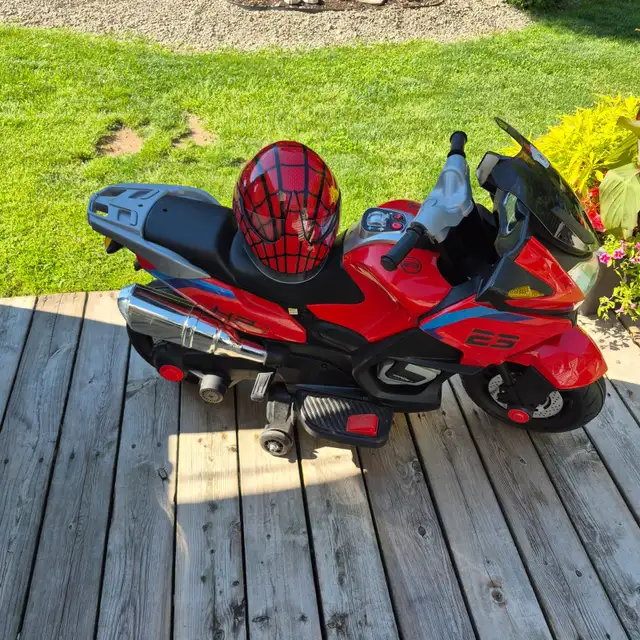 Kids ride on electric motorcycle