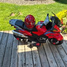 Kids ride on electric motorcycle