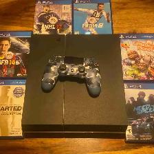 PlayStation 4 with a controller and 6 games