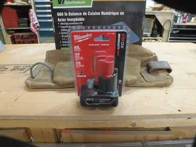 Milwaukee M12  XC  6.0 battery and tool belt