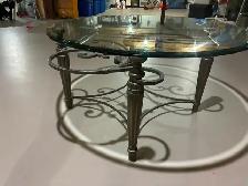 Elegant Round Glass Coffee Table with Ornate Metal Base – $200