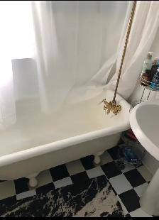Clawfoot tub with faucet