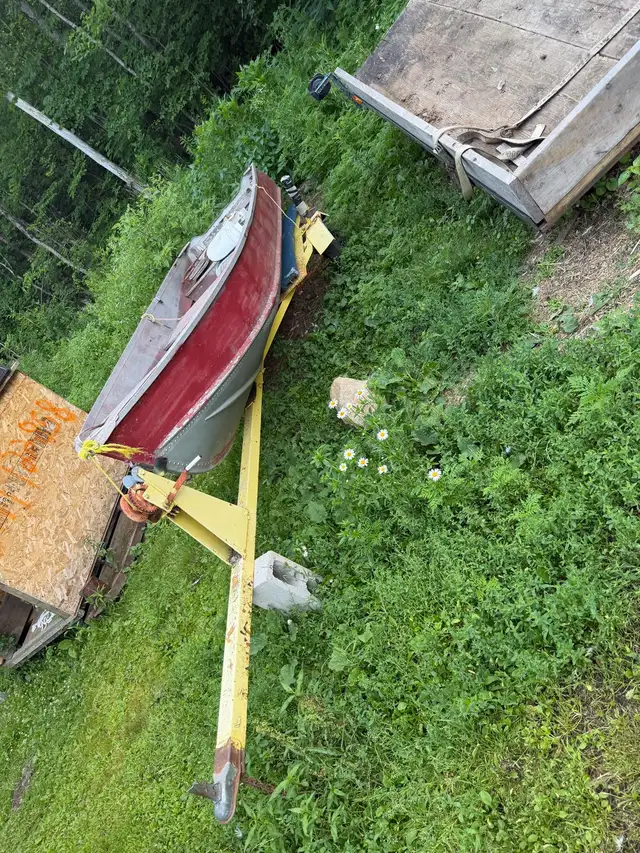 14 foot boat And trailer with a nine point 9 evenrude