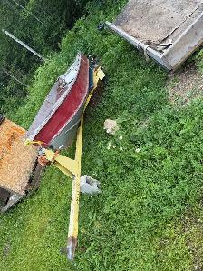14 foot boat And trailer with a nine point 9 evenrude