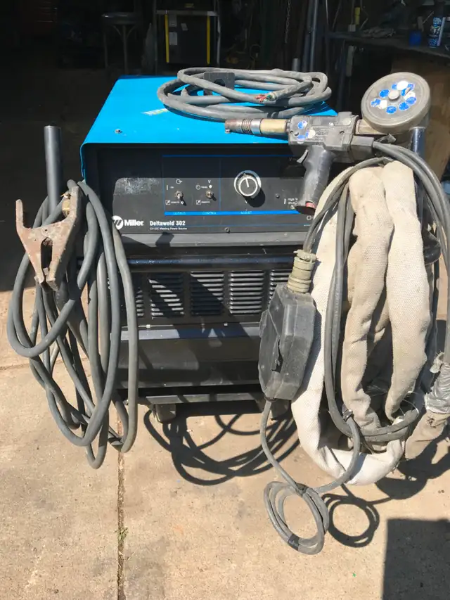 WELDER MILLER 302 WITH ALUMINUM GUN