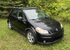 Suzuki SX4 version GLS 2011 4x4, auto.,5 portes,  tres bon état.