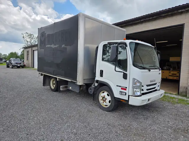 2019 Isuzu NRR Flatdeck with rollback tarp