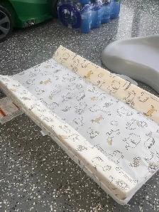 contoured change pad