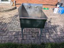 Commercial stainless steel utility sink with backsplash