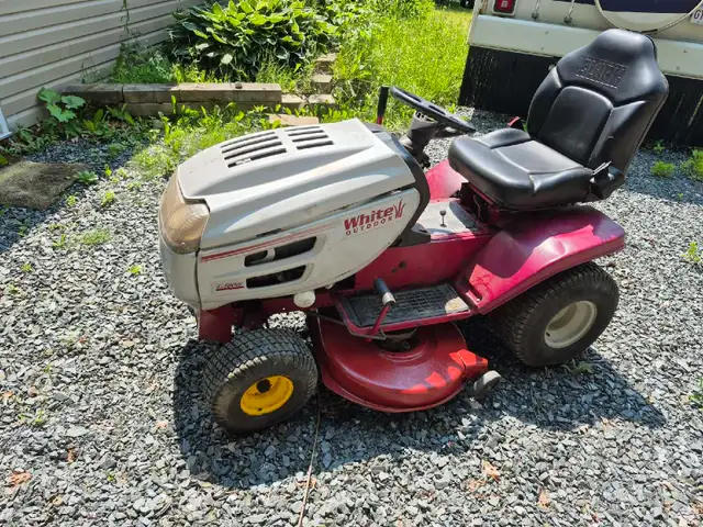 White Outdoor Riding Lawn Mower