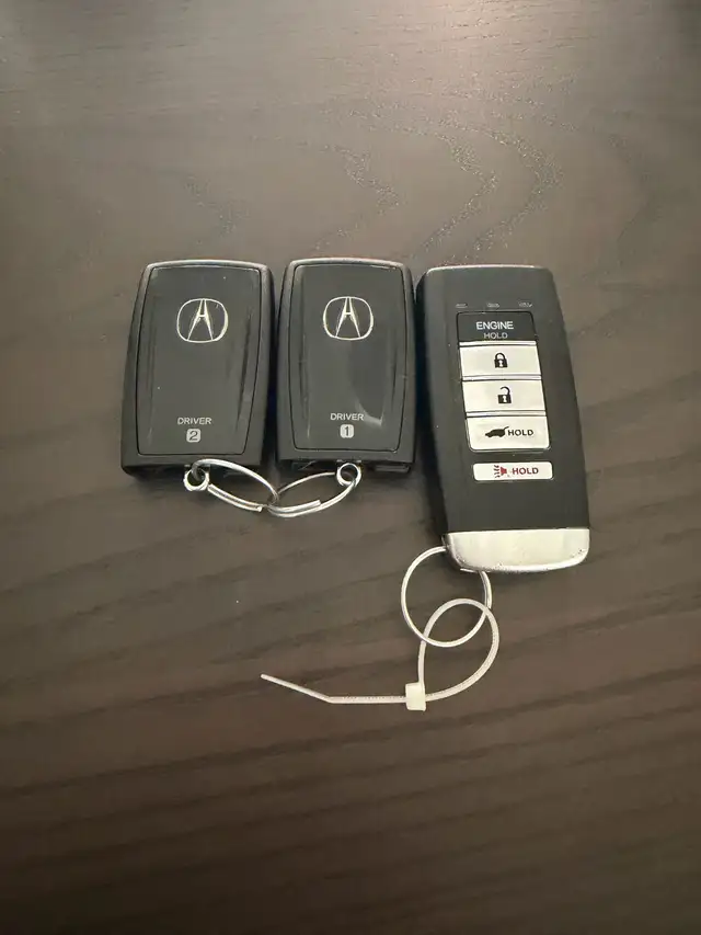 2 Acura key fobs   1 remote starter