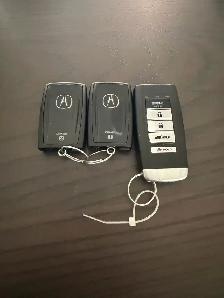 2 Acura key fobs   1 remote starter