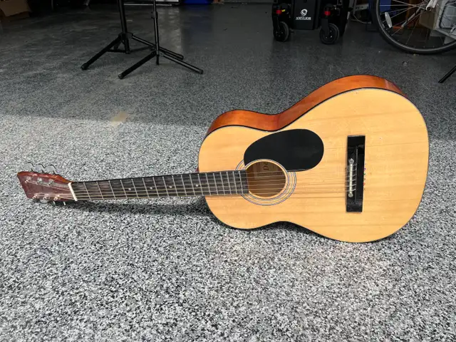 guitar and music sheet stand