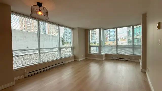 Fresh Paint & New Floor! 2-Bedroom Condo Unit above Crystal Mall