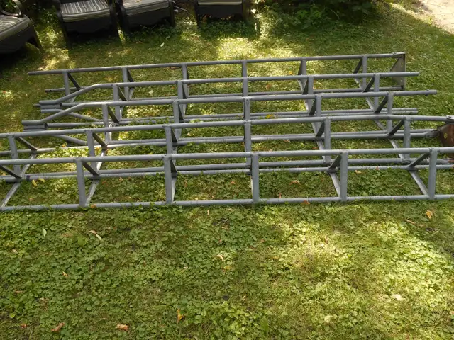 2 light towers, antenna, or communication towers, Disassembled