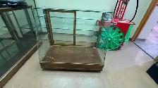 Slanted glass display cabinet